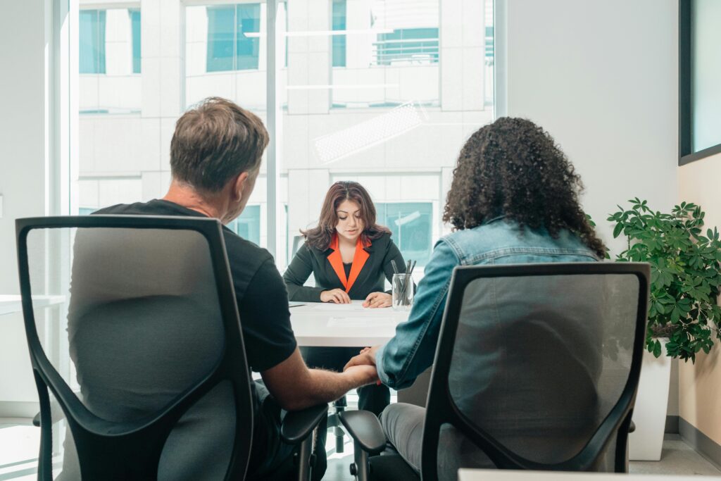 A business consultation in a modern office, depicting collaboration and discussion.