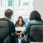 A business consultation in a modern office, depicting collaboration and discussion.